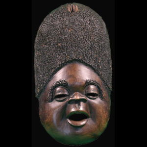 A wooden African mask with an African theme decor and an afro hair.