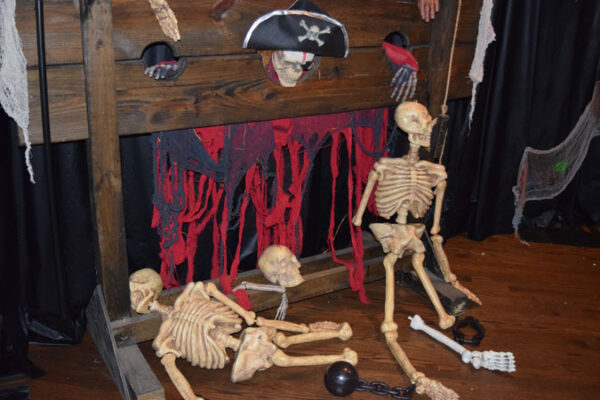 A display of caskets and caskets on a wooden board.