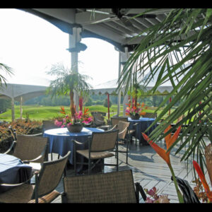 An African Table Design outdoor dining area with tables and chairs.