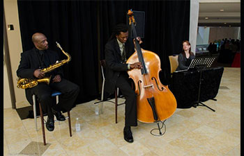 A trio of Event Performers playing cello and saxophone.