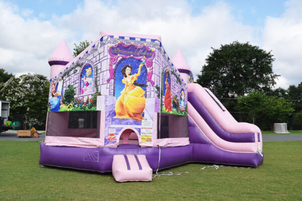 A purple princess bounce house with a slide and inflatable games.