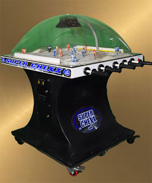 A Golden Tee rental hockey game on a table.