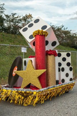 A float with a star and dice on it. Atlantic station light the tree