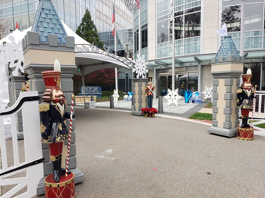 Christmas decorations in front of a building.