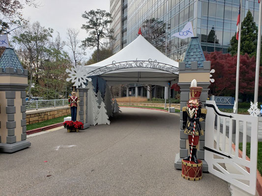 A white tent with a snowman and a nutcracker.