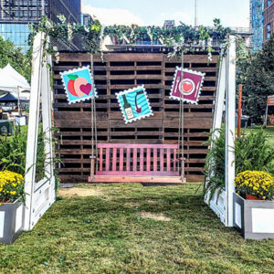 A Garden Swing Photo Op in a grassy area.