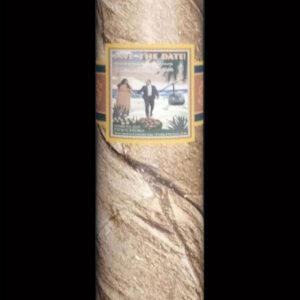 A rolled up Giant Cigar with a picture of a cow on it.