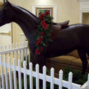 A statue of a horse in a living room.