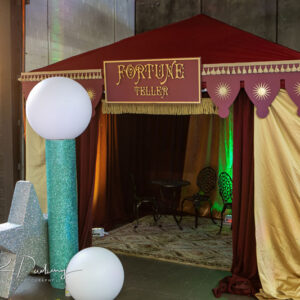 A Fortune Teller Tent set up with balloons and decorations.