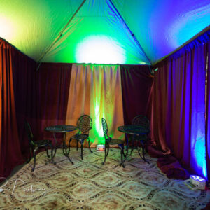 A room with colorful curtains and a Fortune Teller Tent.