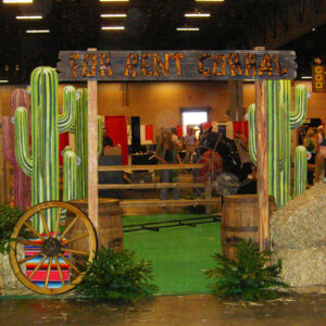 A Cactus Cutouts in the middle of a hay bale.