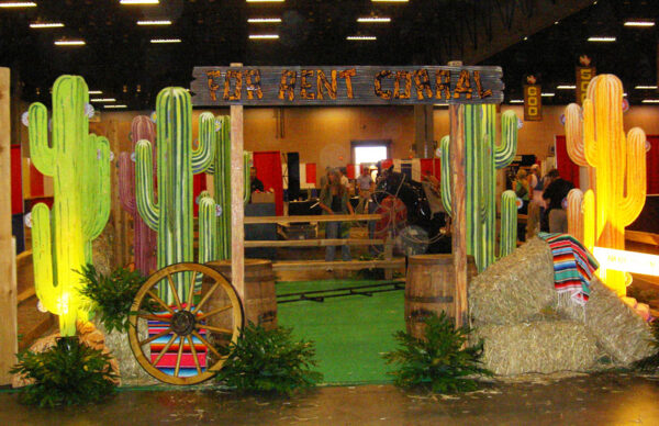 A Cactus Cutouts in the middle of a hay bale.