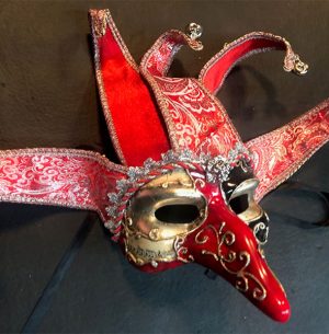 A red and black masquerade mask, perfect for themed decor at a party.